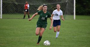 a middleburgh soccer player dribbles the ball
