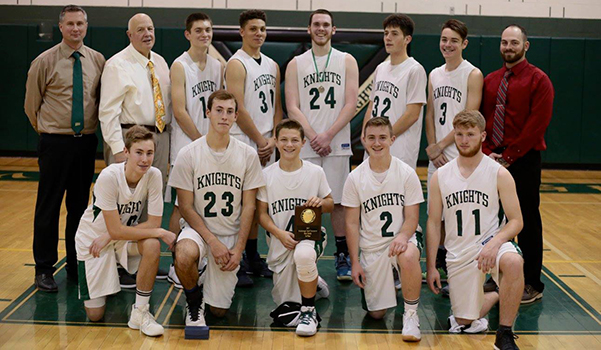 the boys basketball team poses for a picture