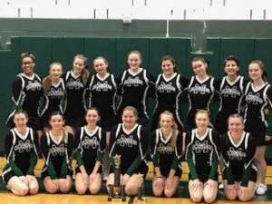 mcs cheerleaders pose with their championship trophy