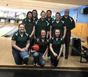 the 2018-19 girls bowling team poses for a picture after winning the WAC