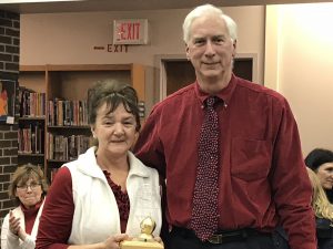 terry bevins poses with her golden knight award