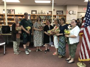 retirees pose for a picture after being honored at the May 23 BOE meeting