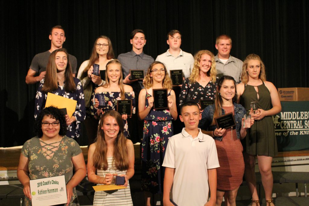 Middleburgh student-athletes hold up their spring and end of the year awards