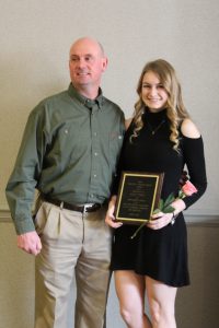 Kelsey Terrell poses with her Scholar Athlete award