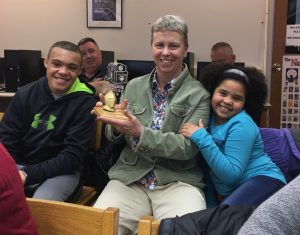 shannon hughes poses with her golden knight award