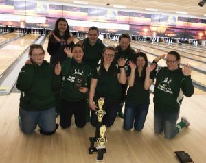 girls varsity bowling poses for a picture after winning the WAC tournament