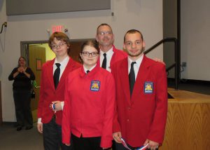 Thomas Cressimanno poses with his first place-winning Crime Scene Investigation team