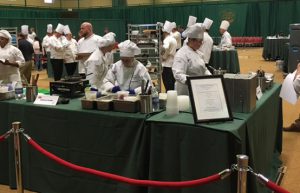 Logan Stephens competes with his teammates on the Capital Region Culinary Team during the state competition.