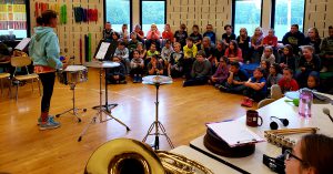 5th and 6th grade students demonstrate band instruments to 3rd grade students during Instrument Demo Days.