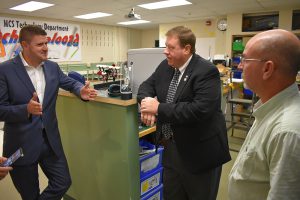 assemblyman chris tague speaks with principal matt sloane and teacher scott gray