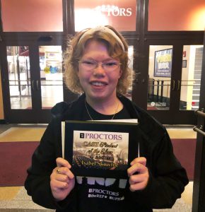 isabel skowfoe poses for a picture with her award