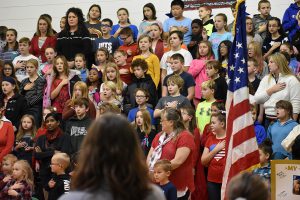 students sing during the veterans day celebration
