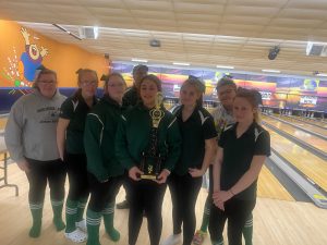 the girls varsity bowling team poses for a picture