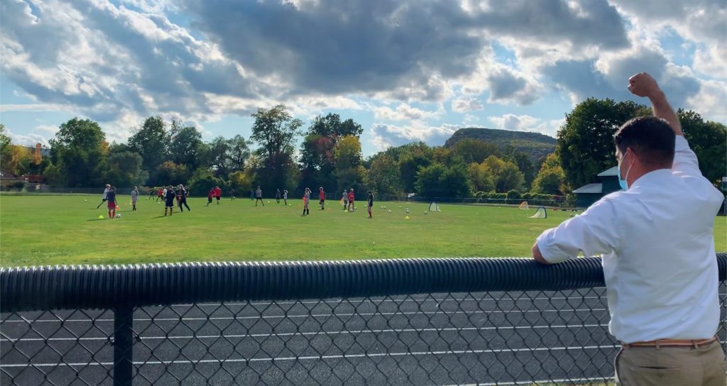 Superintendent Brian Dunn cheers on the Knights at soccer practice.