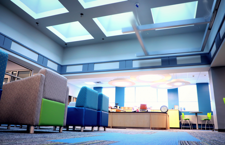 moden school library mostly blues, showing sky lighting and circular lights