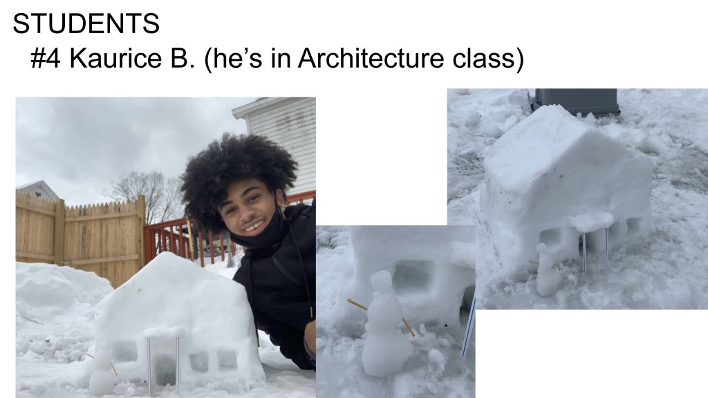 a student leaning in towards miniature snow house with windows cut out and straws as pillars lining the door and an even smaller snowman outside the little house with toothpicks as arms