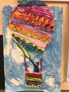 hot air baloon drawing that's up in the sky with swirly clouds. A student picture in in the baloon that is made of dark colors, purple, red, orange, green, magenta. Some lines are smooth, some are circular and some are jagged