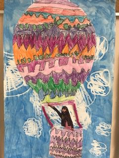 purple, orange, pink, green zigzag pattern on hot air baloon drawing on a cloudy day with picture of student in the basket of the baloon