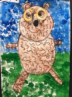 A children's painting of a teddy bear with squiggly hair and glasses standing on grass with a mostly blue sky