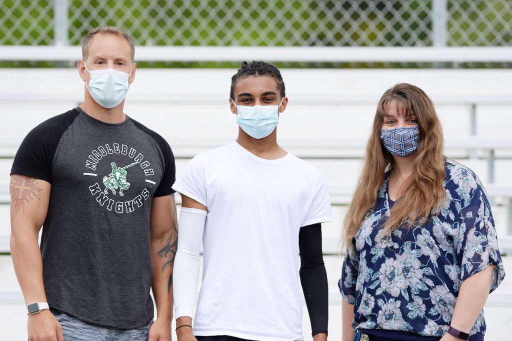 coach, student athlete and mom all wearing face masks