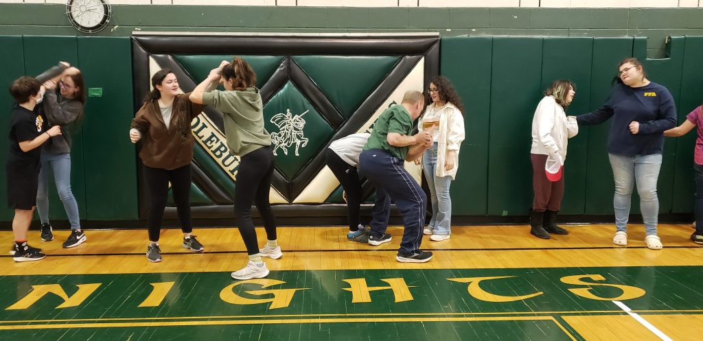 girls learn self defense in gym