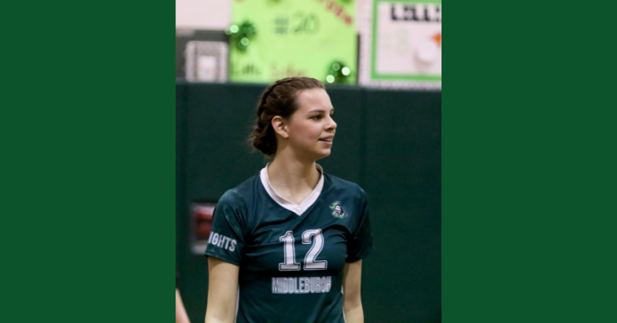 Teen girl looks to the left. She is wearing a Middleburgh Central School District jersey