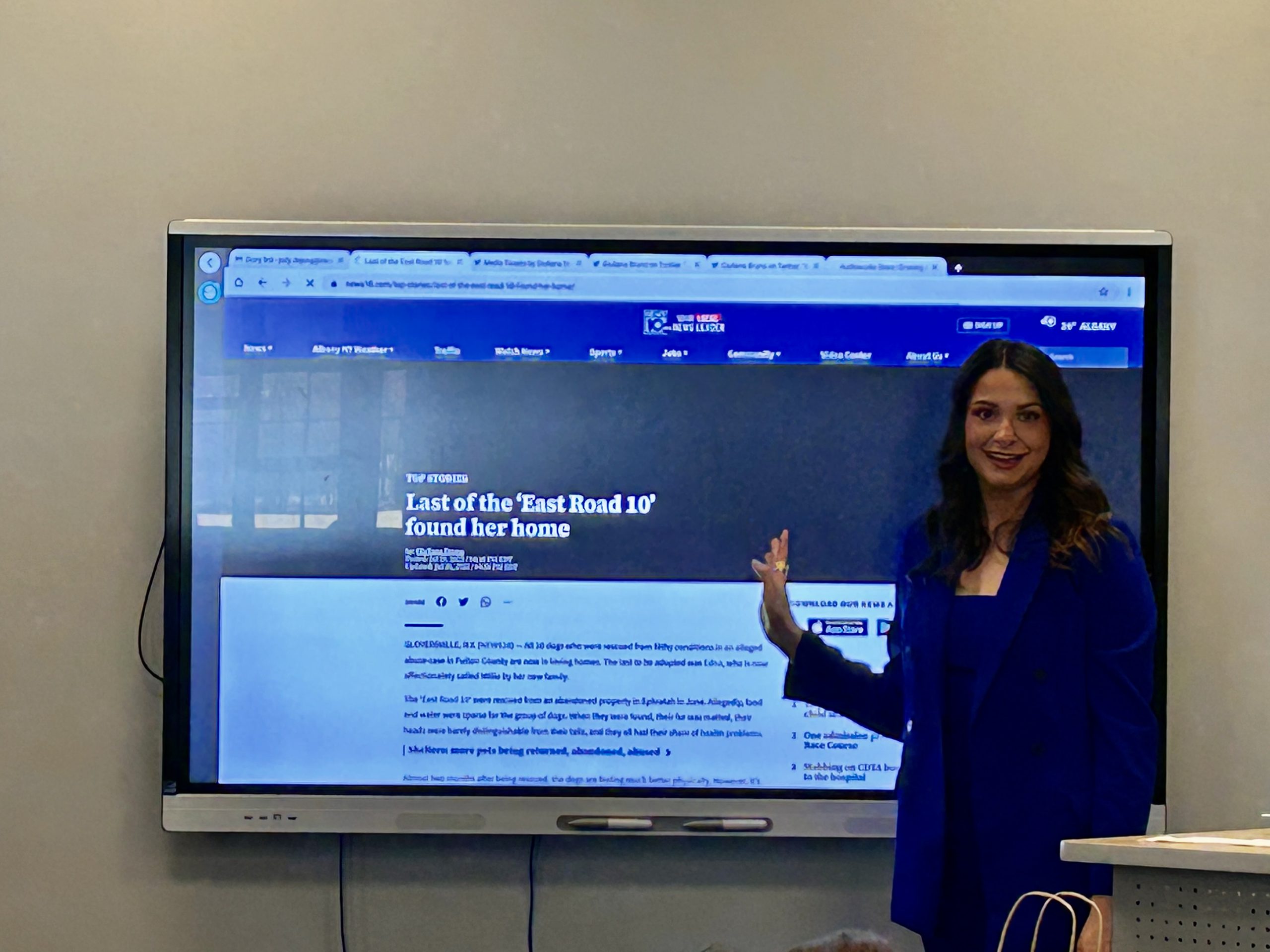 Guiliana Bruno stands in front of electron blackboard