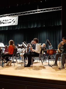 A group of band students on stage.