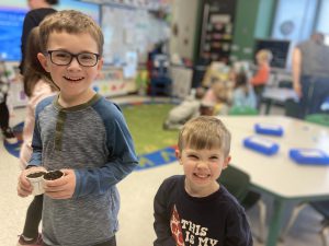 Boys with seed cups.