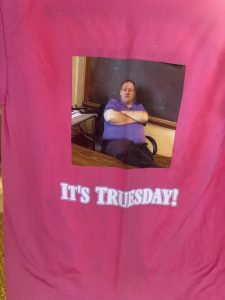 T-shirt with an image of a teacher with his arms crossed. Words say "It's Truesday!"