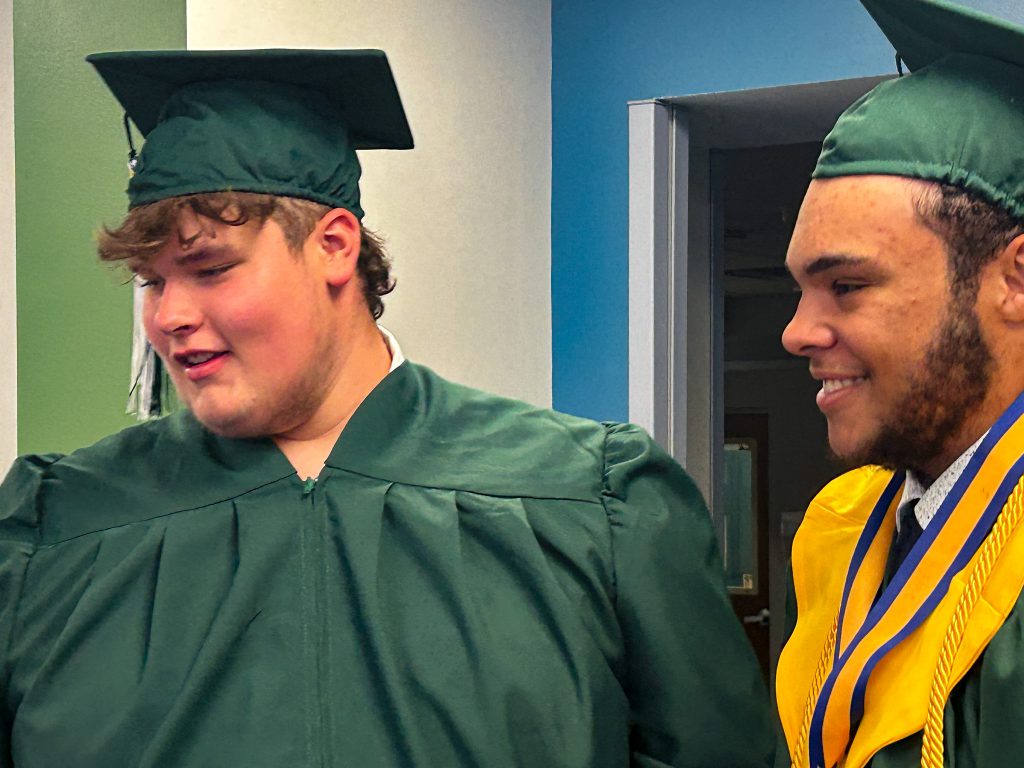 Two students in cap and gowns