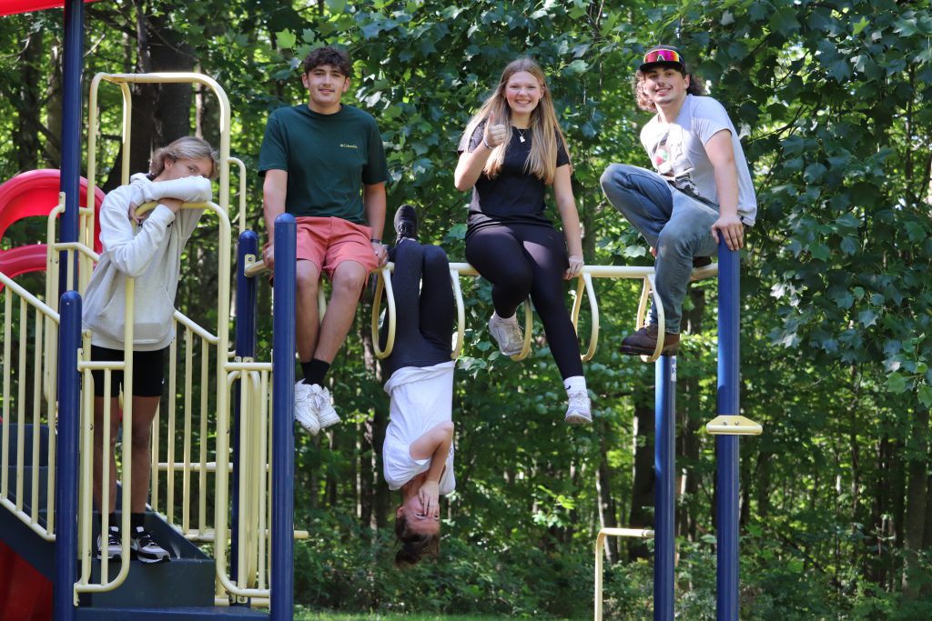 High school seniors on a playground.
