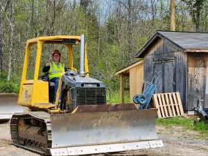 Ashley Moorhead operating a plow.