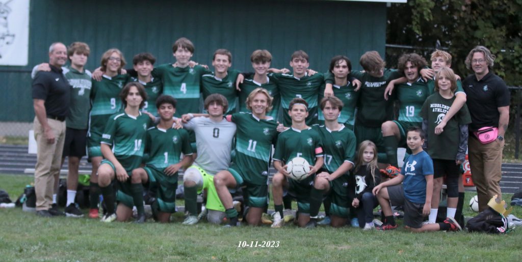 MCS Soccer team stand for group photo.