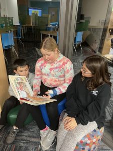 Students reading together.