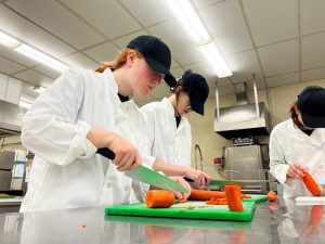 Erica Nahaczewski cuts carrots.