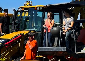 Student Ashley Moorhead on a tractor.