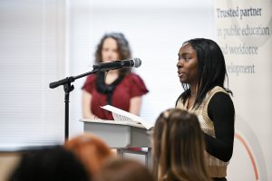 Student speaking at podium.