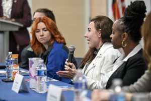 Women speak during panel discussion.