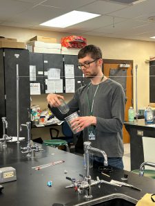 Chemistry teacher in classroom.