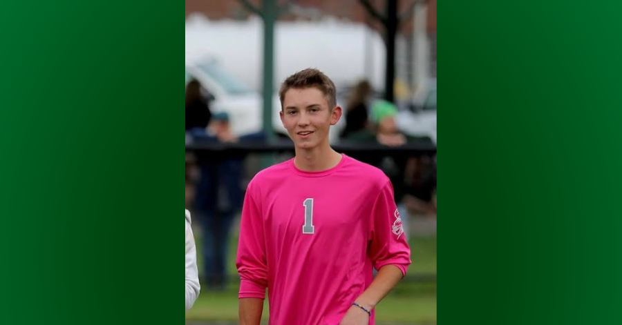 Teen in pink sports shirt.