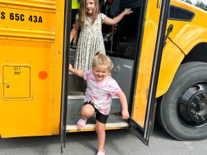 Students getting off bus.