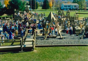 Crowds stand on the site of the newly built Maze Craze.