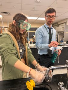 Teacher instructing student during titer experiment.