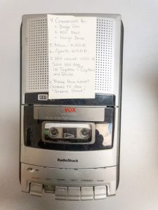 Portable RadioShack cassette recorder with a handwritten note attached listing recordings contained on a Middleburgh Central School District time capsule.