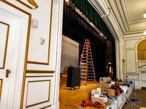 Auditorium lighting and sound upgrades in progress.