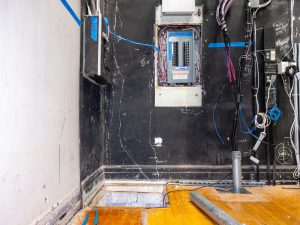 Electrical work underway for auditorium upgrades.