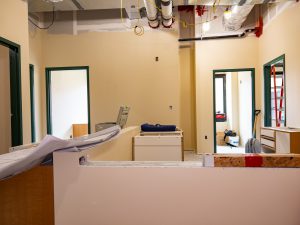 Health clinic renovation area with cabinetry and construction materials.