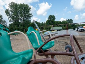 Accessible playground equipment under construction.